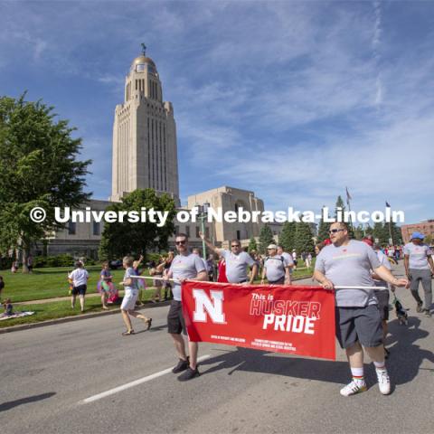 The Husker Pride group walks the parade route around the Nebraska State Capitol on June 19. Thousands attended the inaugural parade. More than 20 members of the university community marched together during Lincoln's first Star City Pride parade. A number of campus administrators, including Chancellor Ronnie Green and his wife, Jane, participated in the walk around the Nebraska State Capitol. Star City Pride parade on June 19, 2021. Photo by Troy Fedderson / University Communication.